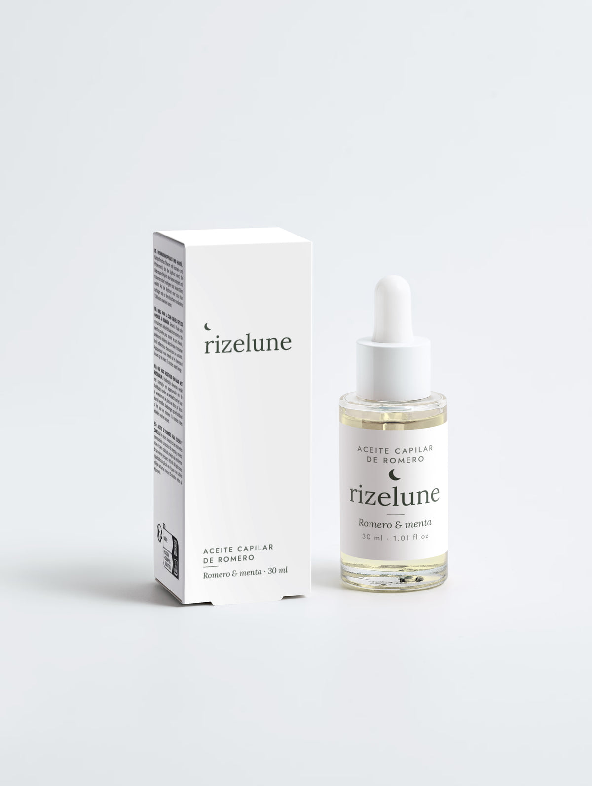 Sérum de romero y menta Rizelune con su caja, vista frontal